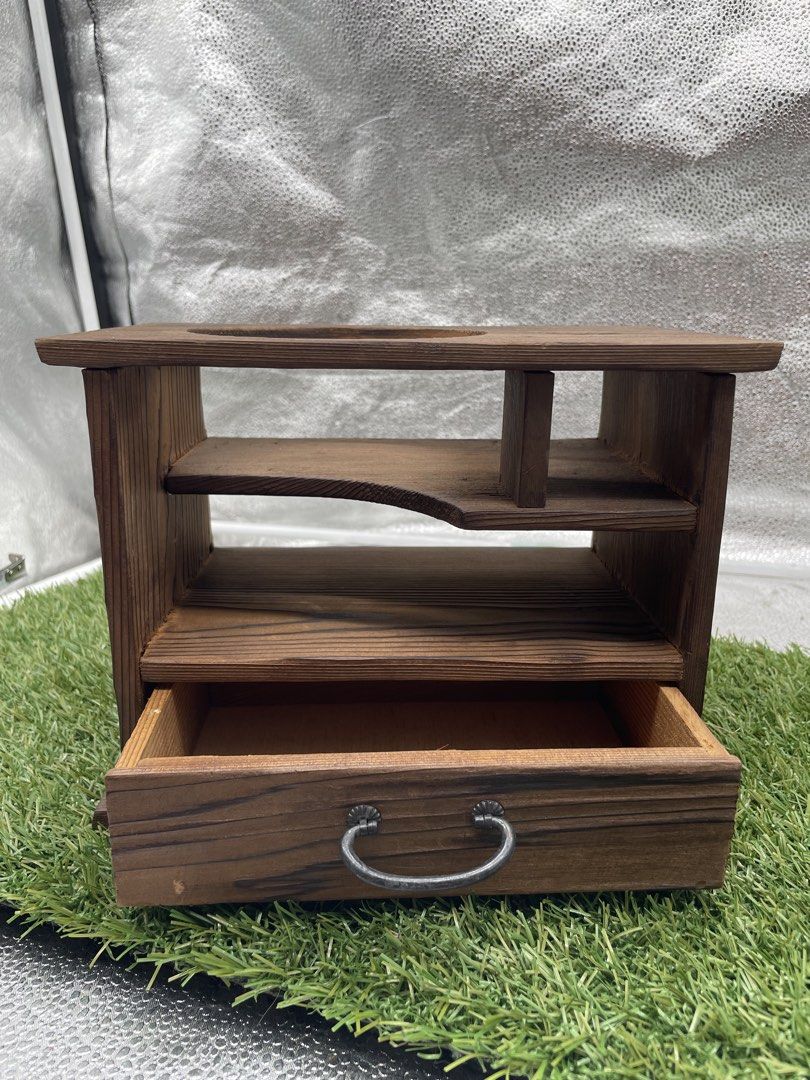Wooden Desk Organizer with Drawer (Category: Shelves, Cabinets & Racks) located in Quezon City. Submitted by eilgaraje (Listing ID 1435933567, Image 3). Description: - Wooden desk organizer - Features a drawer and multiple shelves - Dark brown finish - Unique design with circular cutout - Decorative handle on drawer - Ideal for organizing small items.