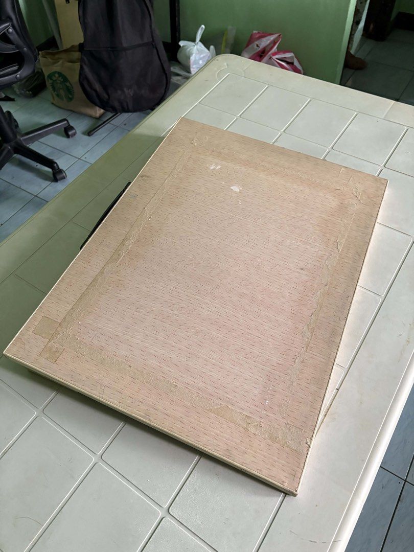 Wooden Drawing Board with Handle (Category: Tables & Sets) located in Manila. Submitted by ciiii1 (Listing ID 1435940675, Image 1). Description: - Wooden drawing board - Built-in handle for easy carrying - Light-colored wood surface - Rectangular shape - Features a border - Minor imperfections present - Functional drawing surface.