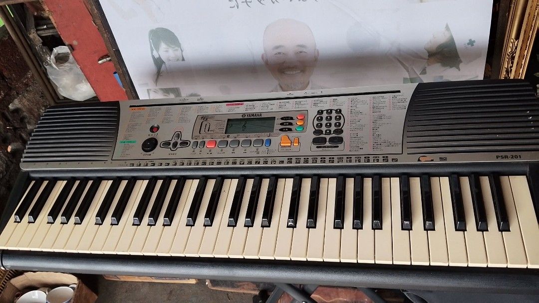 Yamaha PSR-201 Keyboard (Category: Musical Instruments) located in Quezon City. Submitted by jpnvintageonline (Listing ID 1435932292, Image 2). Description: - Yamaha PSR-201 keyboard - Multiple keys and function buttons - Digital display - Built-in speakers - Stylish black and silver color scheme - Classic white and black keys .