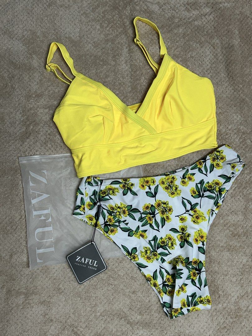 Zaful Floral Surplice Highcut Tankini Set (Category: Bikinis & Swimsuits) located in Caloocan City. Submitted by lilzariyahhhh (Listing ID 1436005321, Image 1). Description: - Zaful bikini set - Bright yellow V-neck top with adjustable straps - Floral print high-waisted bottoms - Comes with original packaging and tags.