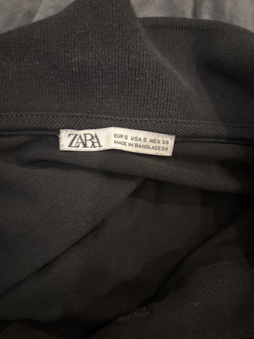 Zara Black Polo Shirt - Size S (Category: Tshirts & Polo Shirts ) located in Malay. Submitted by mforgasm.archive (Listing ID 1436046008, Image 2). Description: - Zara black polo shirt - Size: Small - Features a classic collar - Short sleeves - Made in Bangladesh - Versatile for various occasions.