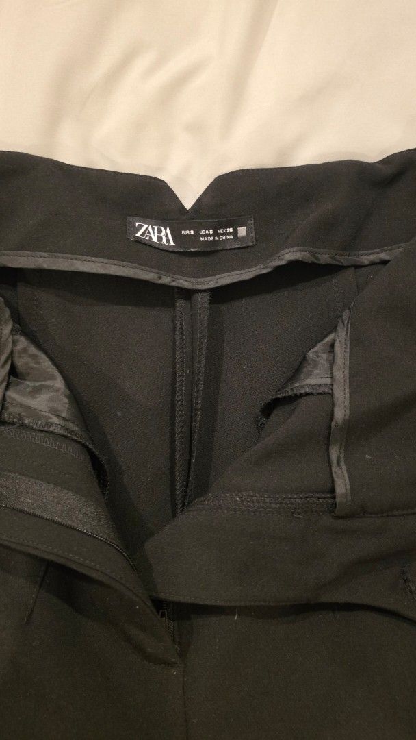 ZARA Black Trousers - Size S (Category: Jeans) located in Muntinlupa City. Submitted by mdoc.declutter (Listing ID 1436042336, Image 2). Description: ZARA Black Tailored Trousers Size: EUR S / US S High-waisted fit Straight leg cut Structured, tailored style Good condition – No major flaws Classic staple piece RFS: Decluttering Shipping from: Muntinlupa / Taguig (c/o buyer) Payment: BDO / BPI / UB / GCash / Maya.