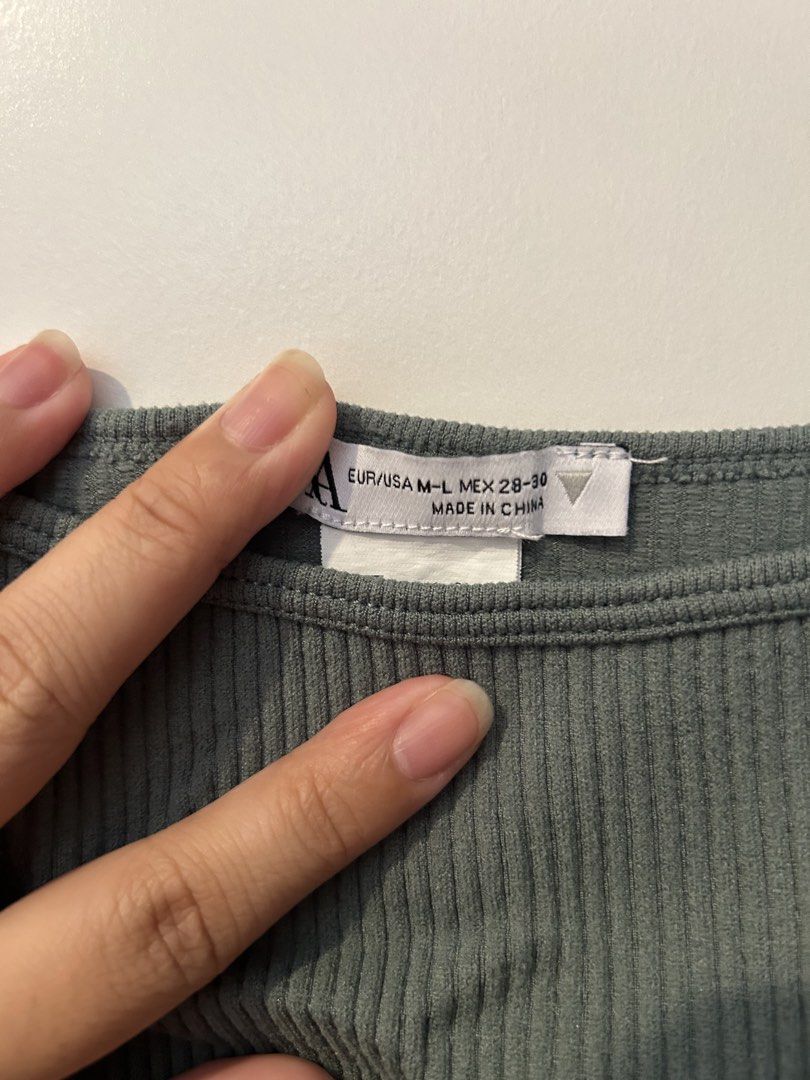 M-L Zara Ribbed Crop Top (Category: Others Tops) located in Manila. Submitted by lex_declutters (Listing ID 1435921862, Image 2). Description: - Zara crop top - Muted green color - Square neckline - Ribbed texture - Size: EUR/USA M-L, MEX 28-30 - Sleeveless - Stretchy material - Versatile style.