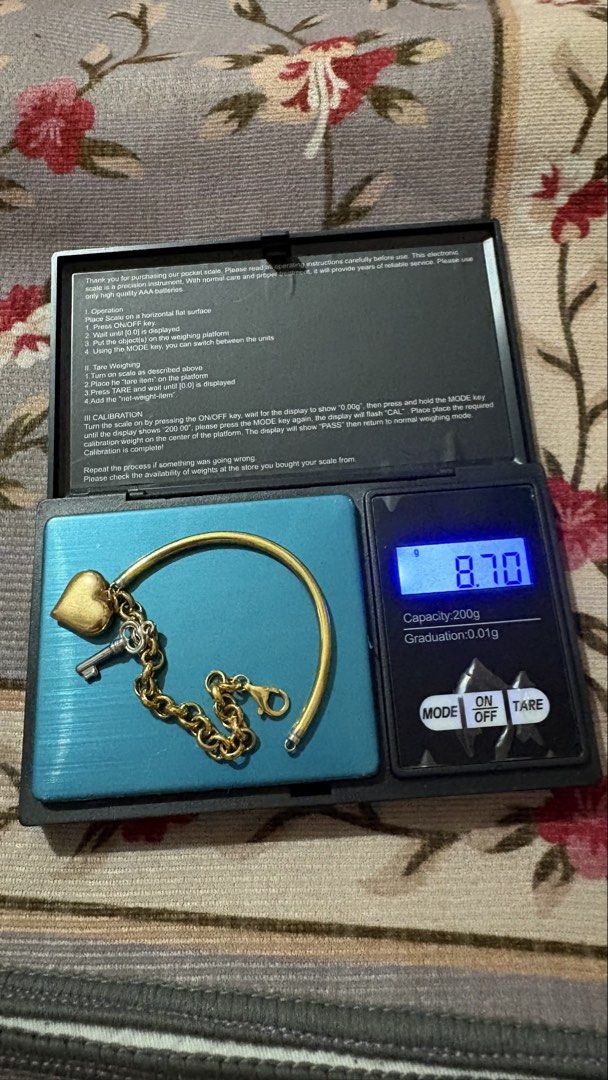 18k Saudi Gold Banglet and Half Hardware (Category: Bracelets) located in Los Banos. Submitted by luxxlady97 (Listing ID 1435352545, Image 2). Description: - Two gold bracelets included. - One bracelet: half hardware chain link design with clasp closure. - Other bracelet: bangle style with heart and key charm. two tone i have other jewelry items for sale at P 7,650 per gram. 18k Saudi Gold Can do meet ups within QC for sure buyers and even inside