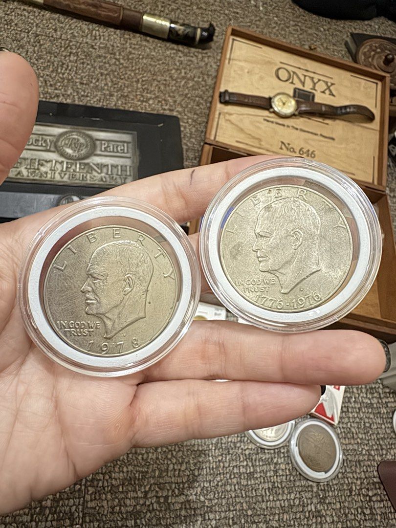 1978 and 1976 Eisenhower Dollar coin (Category: Currency) located in Quezon City. Submitted by brigilseth (Listing ID 1436210805, Image 1). Description: - Includes a 1978 and a 1976 Eisenhower Dollar coin. - Coins are in protective cases. - Well-preserved condition. - Perfect for coin collectors or history enthusiasts..