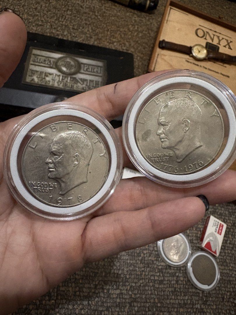 1978 and 1976 Eisenhower Dollar coin (Category: Currency) located in Quezon City. Submitted by brigilseth (Listing ID 1436210805, Image 2). Description: - Includes a 1978 and a 1976 Eisenhower Dollar coin. - Coins are in protective cases. - Well-preserved condition. - Perfect for coin collectors or history enthusiasts..