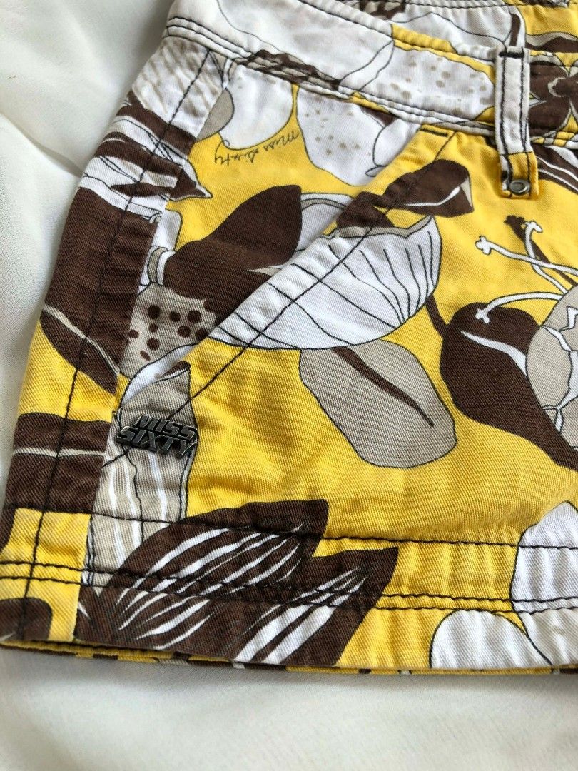 2000s Miss Sixty Floral Print Shorts (Category: Shorts) located in General Santos City (Dadiangas). Submitted by roxys_thrift (Listing ID 1411072341, Image 3). Description: FIRST PHOTO IS NOT MINE! but same quality, cttro! - Miss Sixty shorts - Size 27 - Button closure - Eye-catching floral print - Colors: Yellow, brown, white, and gray - Adds a pop of color to your outfit.