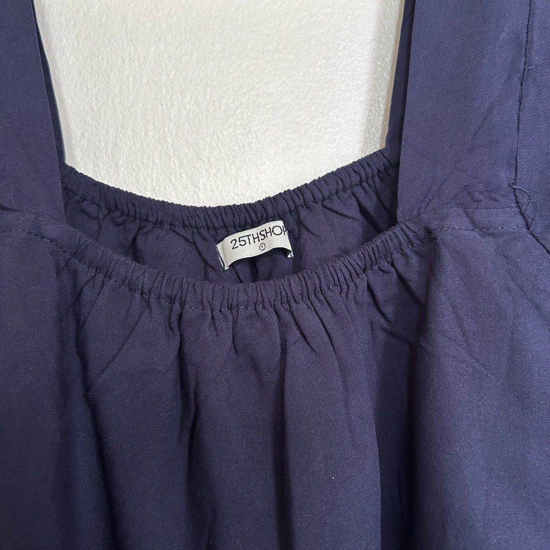25THSHOP Navy Blue Square Neck Dress (Category: Dresses) located in Caloocan City. Submitted by mariasonya (Listing ID 1436102772, Image 3). Description: - Navy blue dress from 25THSHOP - Square neckline - Three-quarter sleeves - Tiered design - Ruffled hem - Lightweight fabric - Ideal for casual wear.