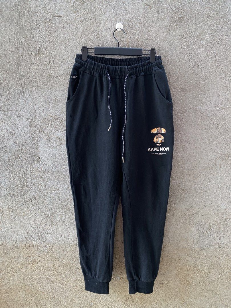 Aape (Category: Joggers) located in Candaba. Submitted by dejesus.bench17 (Listing ID 1436206485, Image 1). Description: Aape Jogging Type Pants -Brand: Aape By Bathing Ape -Condition: Good -Color rate: 9/10 -Dimes: W30-34 L37 -Issue: minimal crack print need wash -Price: 500 + ship.