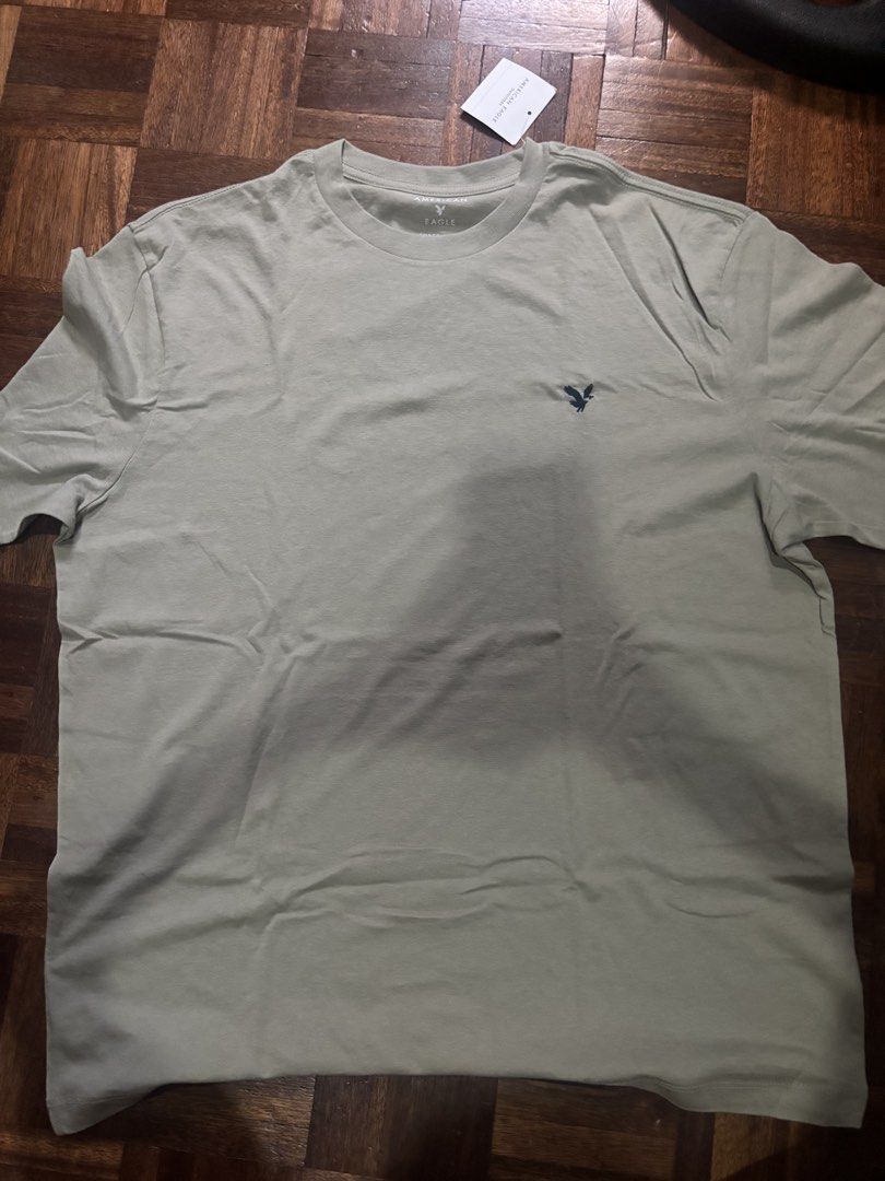 American Eagle Outfitters T-shirt (Category: Tshirts & Polo Shirts ) located in Caloocan City. Submitted by cruizeandco (Listing ID 1436203117, Image 1). Description: - American Eagle Outfitters t-shirt - Light green color - Crew neck style - Features a small logo on the chest - Brand new with original tag attached.