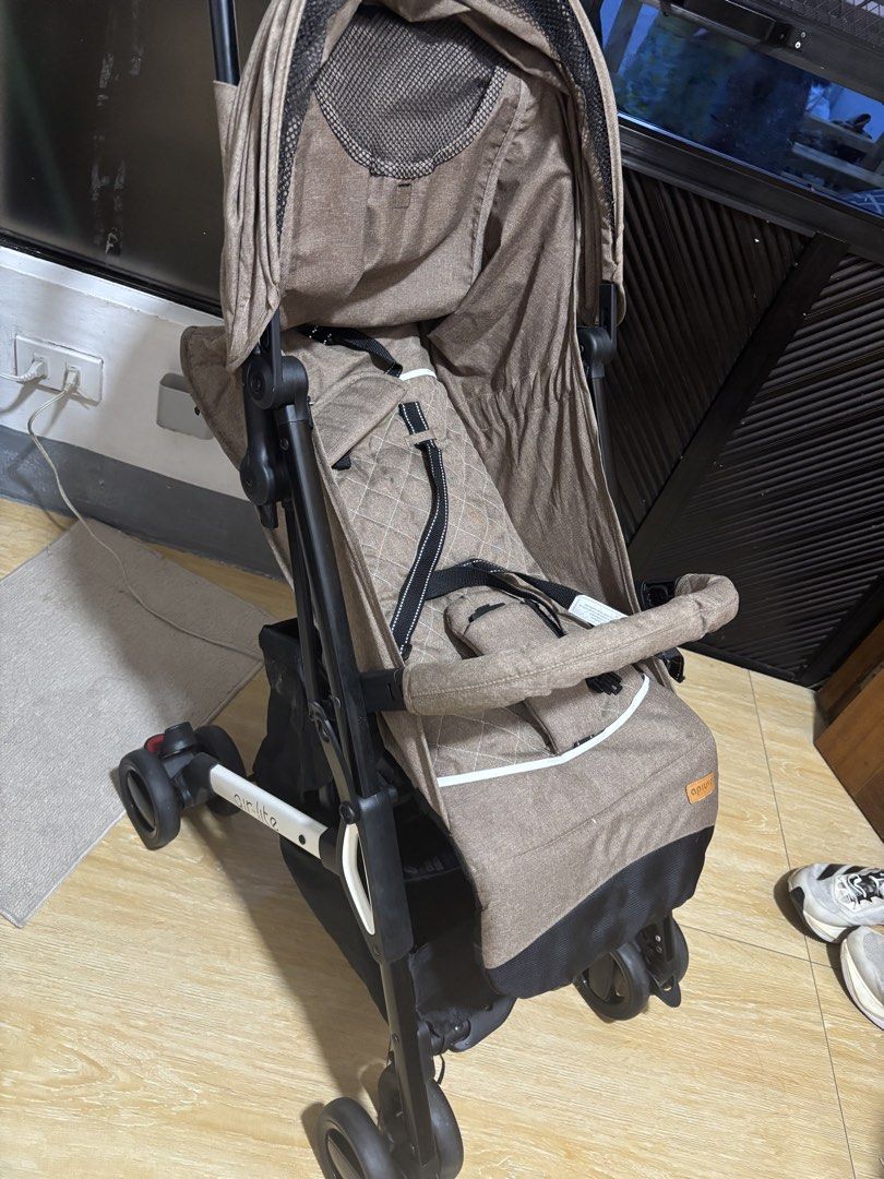 Apruva Air-lite Travel Stroller (Category: Strollers) located in Dasmarinas. Submitted by onnasamson (Listing ID 1436235569, Image 2). Description: - Air-lite stroller with brown canopy and seat -Cabin approved - Foldable for easy storage and transport - Features a safety harness - Includes a convenient storage basket - Suitable for babies and toddlers.