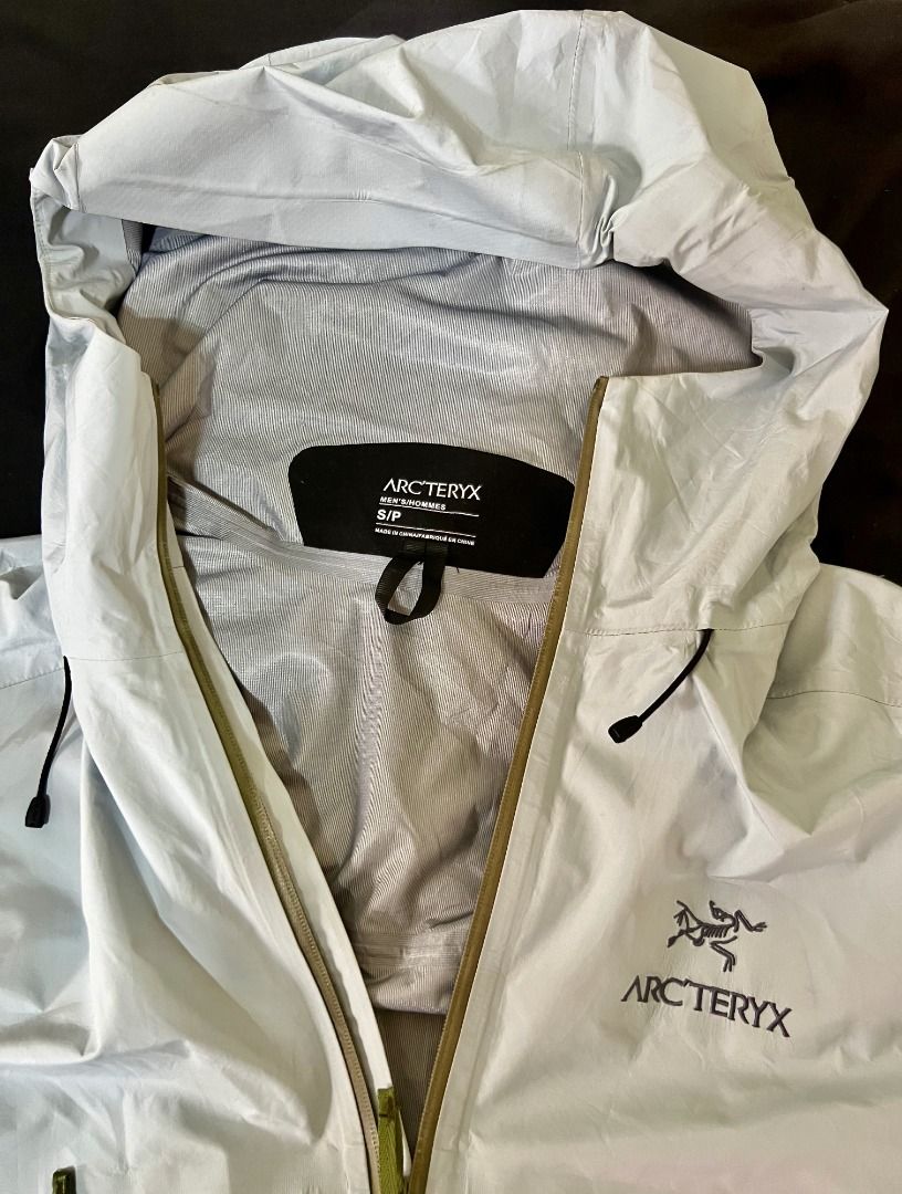 ARCTERYX Beta LT Shell Jacket - Ether Blue & Olive Green Zipper (Category: Coats, Jackets and Outerwear) located in Taguig. Submitted by LessThan (Listing ID 1436245678, Image 3). Description: ARCTERYX Softshell Hooded Lightweight Shell Jacket Light/Ether blue color & olive green zipper Size: Body (21" x 29" inches), Sleeves (27" x 6"-9" inches) 1.5 lbs(0.68 kg) - Features a hood for added protection - Constructed with Gore-Tex material - Lightwe