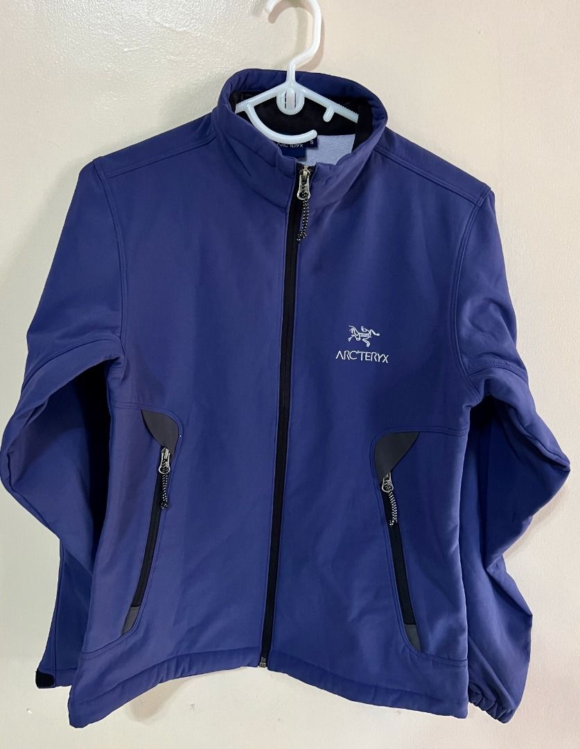Arcteryx Softshell Jacket - BlueViolet (Category: Coats, Jackets and Outerwear) located in Taguig. Submitted by LessThan (Listing ID 1436240798, Image 1). Description: Arc'teryx softshell jacket Blue-violet color Size: Body (17" x 23" inches), Sleeves (22" x 5"-8" inches) - Full-zip closure - Two zippered hand pockets - Zippered chest pocket - Arc'teryx logo on chest - Fitted sleeves.