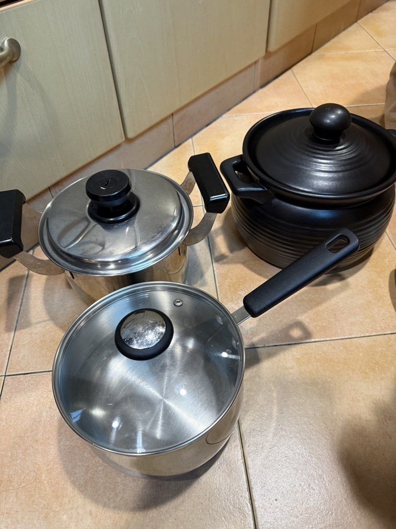 Assorted Kitchenware: Pots, Slow Cookers, and Mixing Bowl