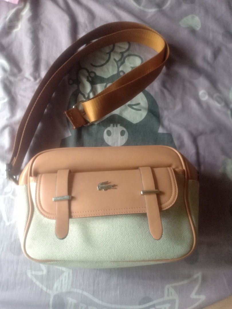 Bag | Lacoste (Category: Shoulder Bags) located in Manila. Submitted by akiramarie (Listing ID 1436132725, Image 1). Description: Bought it for 2,800. Di po sya masyado nagamit natambak lang po, with model card po. Honest Issue: Natanggal po yung strap nya kaya binawasan kopo yung price pwede naman po maipatahi.