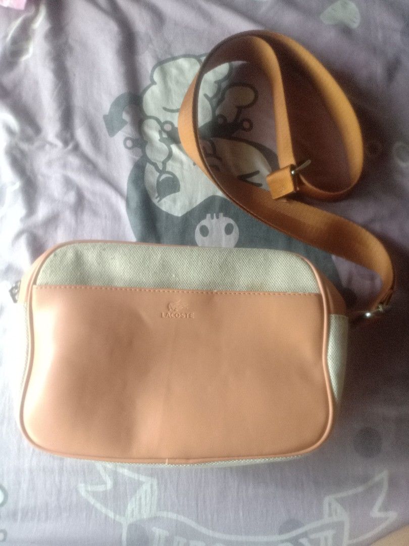 Bag | Lacoste (Category: Shoulder Bags) located in Manila. Submitted by akiramarie (Listing ID 1436132725, Image 2). Description: Bought it for 2,800. Di po sya masyado nagamit natambak lang po, with model card po. Honest Issue: Natanggal po yung strap nya kaya binawasan kopo yung price pwede naman po maipatahi.