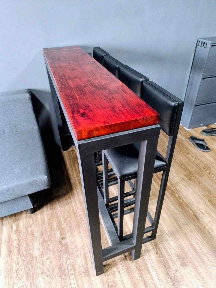 Space Saving Bar Table Set for Food Business, Cafe, Restaurant (Category: Tables & Sets) located in Manila. Submitted by vendorhappy (Listing ID 1436206263, Image 2). Description: Bar Table: - 12L x 54W x 42H inches - Solid mahogany wood top smooth finish - Matte black steel frame Bar Stool 4 pieces: - 11L x 11W x 41.5H inches (29 inches seat height) - Black faux leather back and seat rest cushions - Matte black steel frames Non package price: Ta