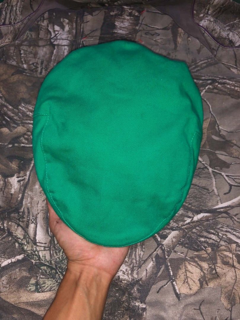 Burberry Green Newsboy Cap (Category: Caps & Hats) located in Rizal. Submitted by softluck.555 (Listing ID 1436200994, Image 1). Description: Authentic Burberry newsboy cap in vibrant green. Features the iconic Burberry check lining and logo. Made in England. Size 1. The cap has a classic shape and is a stylish accessory..