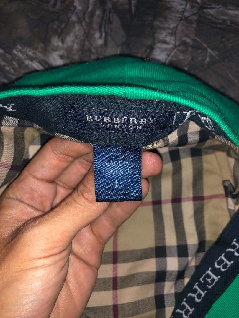 Burberry Green Newsboy Cap (Category: Caps & Hats) located in Rizal. Submitted by softluck.555 (Listing ID 1436200994, Image 3). Description: Authentic Burberry newsboy cap in vibrant green. Features the iconic Burberry check lining and logo. Made in England. Size 1. The cap has a classic shape and is a stylish accessory..
