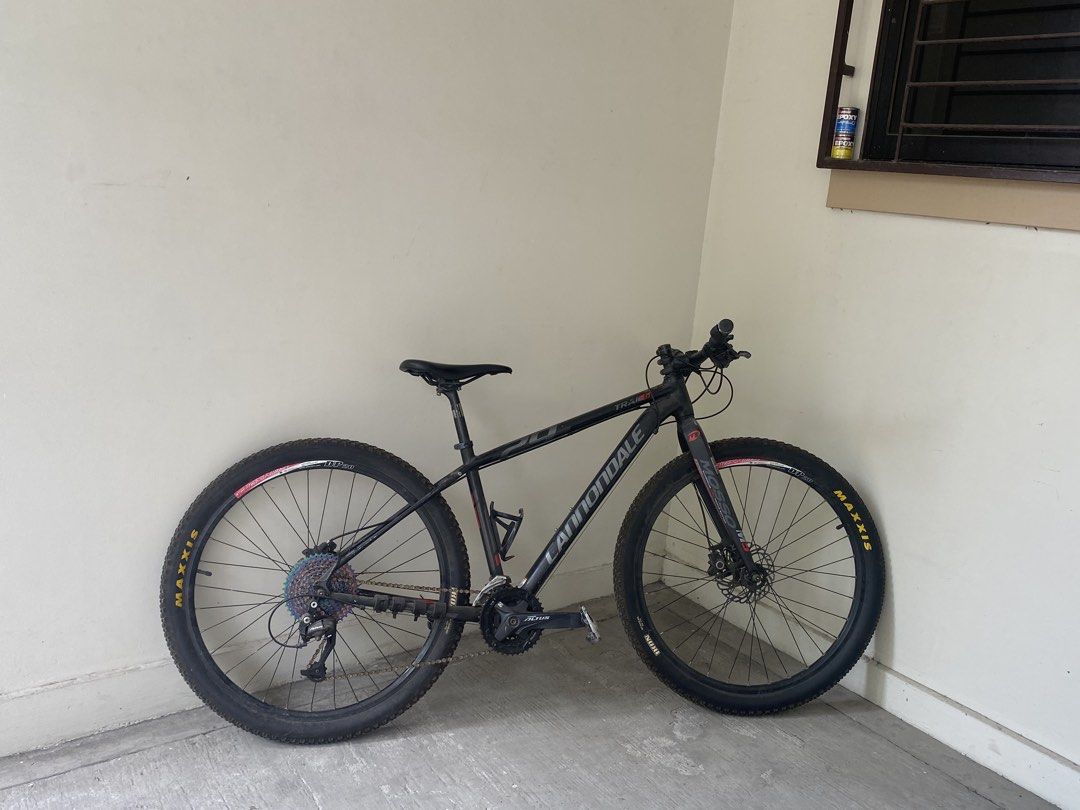 Cannondale Trail 6 Mountain Bike (Category: Bicycles) located in Manila. Submitted by camille08092020 (Listing ID 1436232190, Image 2). Description: Cannondale Trail 6 mountain bike. Features disc brakes and Maxxis tires. The bike has a black frame with red accents. The bike has a comfortable seat and a gear system for various terrains. Perfect for both casual rides and more challenging adventures..