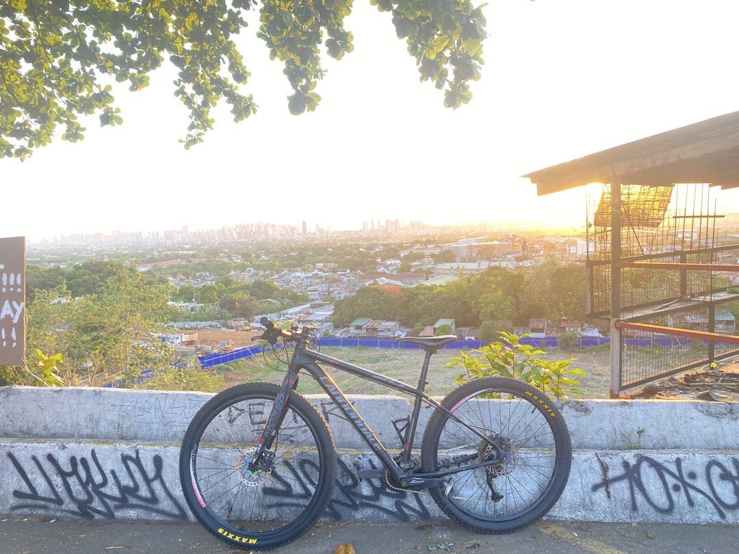 Cannondale Trail 6 Mountain Bike (Category: Bicycles) located in Manila. Submitted by camille08092020 (Listing ID 1436232190, Image 1). Description: Cannondale Trail 6 mountain bike. Features disc brakes and Maxxis tires. The bike has a black frame with red accents. The bike has a comfortable seat and a gear system for various terrains. Perfect for both casual rides and more challenging adventures..