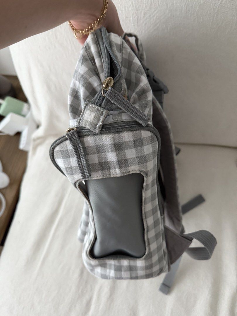 Carters Diaper Bag - Grey Gingham (Category: Diaper Bags & Wetbags) located in Makati City. Submitted by inezlebron (Listing ID 1436223276, Image 3). Description: - Classic grey gingham pattern - Multiple compartments for organization - Includes side pockets and a front zippered pocket - Can be worn as a backpack - Minor stains on the top of the bag.