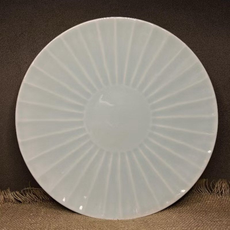 Celadon Platter with Radial Design (Category: Dinnerware & Cutlery) located in Bulacan. Submitted by ceramicscubby (Listing ID 1436224435, Image 1). Description: Size: 12.25 D x 1.3 H in. ❗️CLOSING DOWN SALE, ALL PRICES ARE MARKED DOWN. WE WILL NOT BE ACCEPTING OFFERS LOWER THAN OUR ASKING PRICE. ❗️ - Elegant celadon plate - Features a radial design - Beautiful light blue-green color - Circular foot on the underside - Adds a touch of elegance to 