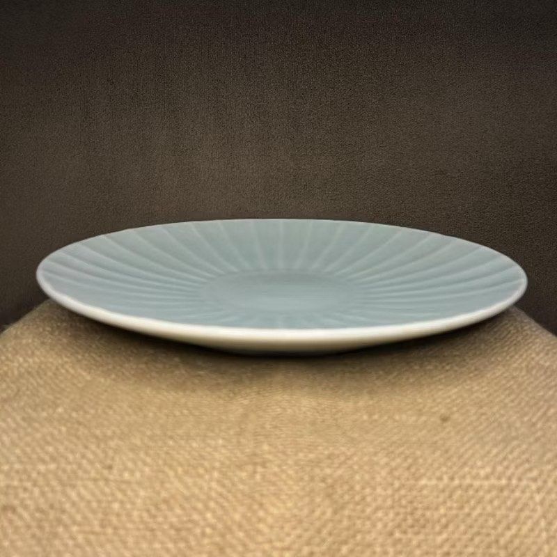 Celadon Platter with Radial Design (Category: Dinnerware & Cutlery) located in Bulacan. Submitted by ceramicscubby (Listing ID 1436224435, Image 2). Description: Size: 12.25 D x 1.3 H in. ❗️CLOSING DOWN SALE, ALL PRICES ARE MARKED DOWN. WE WILL NOT BE ACCEPTING OFFERS LOWER THAN OUR ASKING PRICE. ❗️ - Elegant celadon plate - Features a radial design - Beautiful light blue-green color - Circular foot on the underside - Adds a touch of elegance to 
