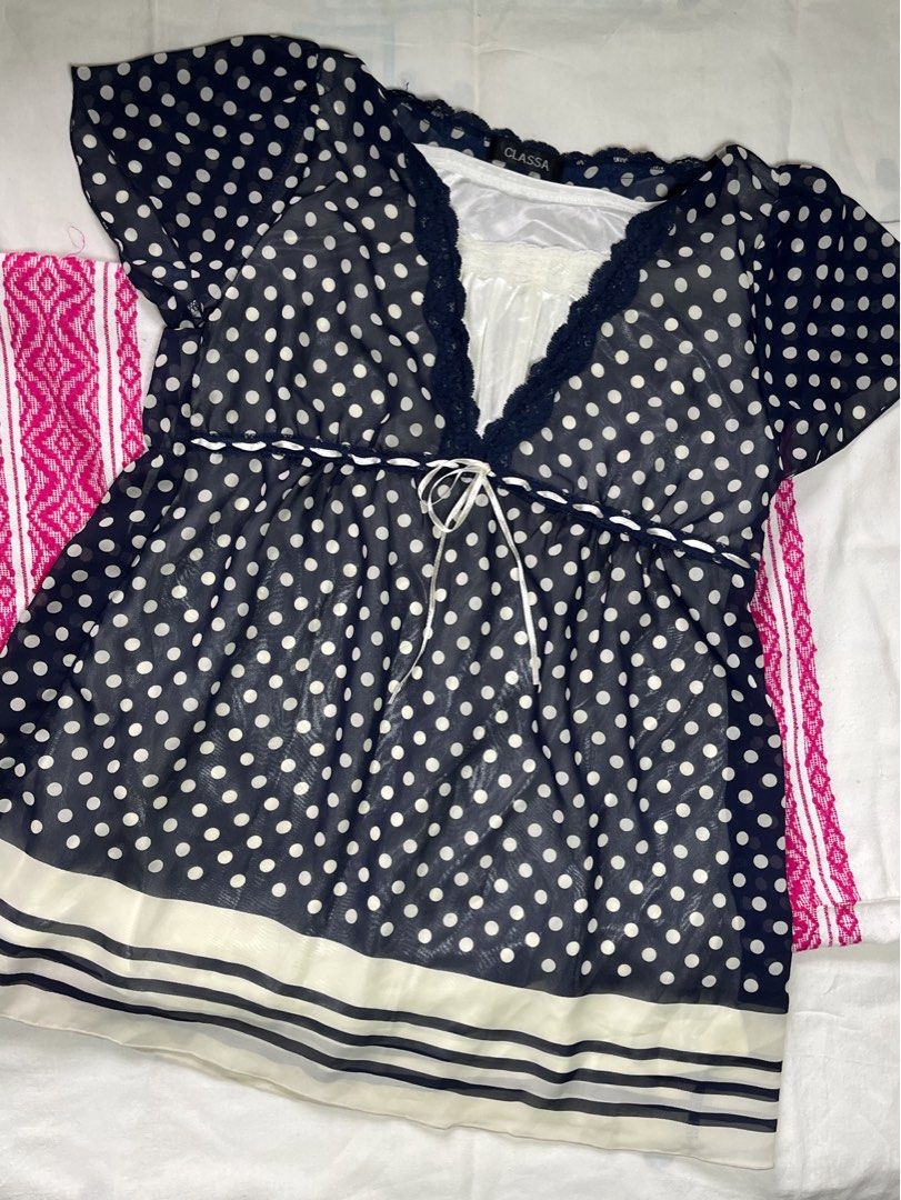 Classa Polka Dot Blouse/Top (Category: Blouses) located in Manila. Submitted by katneededspace_ (Listing ID 1436158624, Image 1). Description: - Classa dress - Navy blue polka dot pattern - White lining - V-neckline with lace trim - Tie waist - Short sleeves - Striped detail at the bottom - Barely worn .