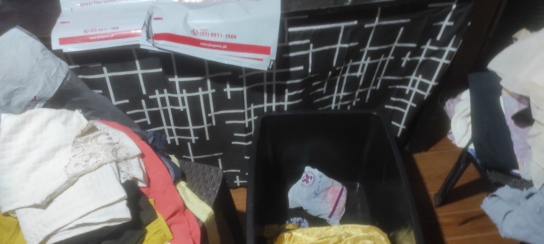 Clothes Bundle - Assorted Items (Category: Others Tops) located in San Jose del Monte. Submitted by nicesiger (Listing ID 1436274331, Image 3). Description: - Assorted clothing bundle - Includes tops, dresses, and other items - Items packed in a plastic bag - Visible items: beige coat, various tops 2000pesos for 250 pcs - Ready for shipping via J&T Express.