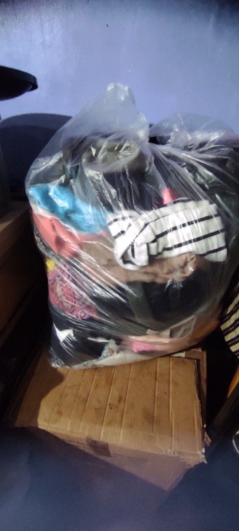 Clothes Bundle - Assorted Items (Category: Others Tops) located in San Jose del Monte. Submitted by nicesiger (Listing ID 1436274331, Image 2). Description: - Assorted clothing bundle - Includes tops, dresses, and other items - Items packed in a plastic bag - Visible items: beige coat, various tops 2000pesos for 250 pcs - Ready for shipping via J&T Express.