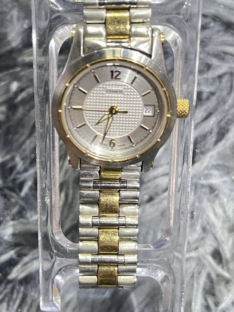 Coach Two-Tone Stainless Steel Watch (Category: Luxury Watches) located in Binangonan. Submitted by chasechloe (Listing ID 1436163339, Image 3). Description: - Coach watch - Silver dial with gold-tone hands and markers - Date display at 3 o'clock - Two-tone stainless steel bracelet - Gold-tone crown - Coach logo visible - Sapphire crystal - Swiss movt..