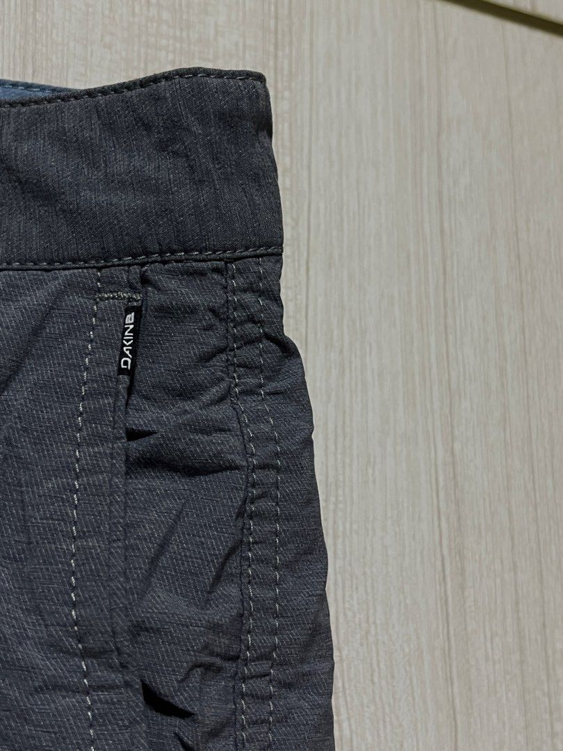 Dakine Gray Shorts Size 32 (Category: Shorts) located in Bulacan. Submitted by sef19 (Listing ID 1436208453, Image 3). Description: - Dakine Gray Shorts - Size: 32 - Features: Button closure, multiple pockets - Material: Lightweight, textured fabric - Suitable for: Casual wear - Details: Dakine logo on back pocket, Made in China.