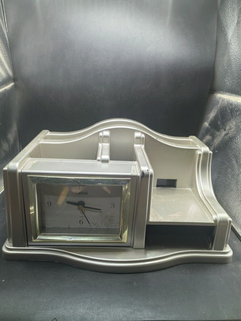 Desk Stationary Clock (Category: Clocks) located in Cebu City. Submitted by dudes_villanueva (Listing ID 1436265435, Image 1). Description: Desk Stationary Clock. Branded: Kansai 📌 Has few lacking parts. Still in good condition. 📌 Working Clock 📌 AA battery operated (Not included) 📌 Few scratches and adhesive residue (can be removed).