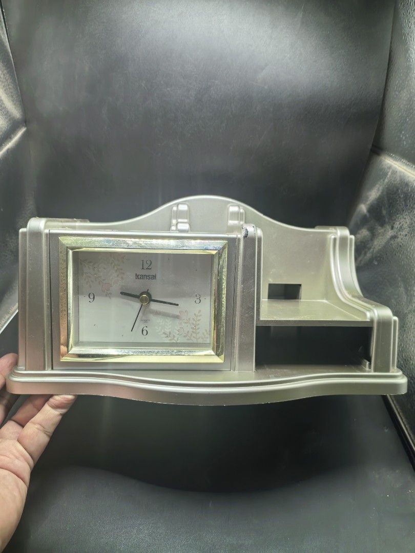 Desk Stationary Clock (Category: Clocks) located in Cebu City. Submitted by dudes_villanueva (Listing ID 1436265435, Image 2). Description: Desk Stationary Clock. Branded: Kansai 📌 Has few lacking parts. Still in good condition. 📌 Working Clock 📌 AA battery operated (Not included) 📌 Few scratches and adhesive residue (can be removed).