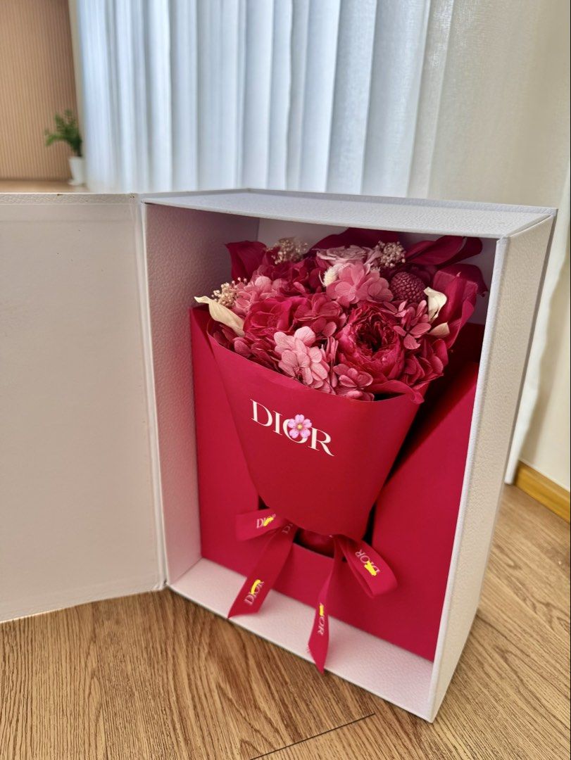 Dior Flower Bouquet in Box (Category: Flowers & Bouquets) located in Quezon City. Submitted by lc_ac (Listing ID 1436212275, Image 1). Description: - Dior flower bouquet - Presented in a signature box - Features a mix of vibrant pink flowers - Beautifully arranged and wrapped in Dior-branded paper - Includes a matching ribbon - White box with gold Dior lettering and floral accents - Perfect for Mother’s Day VVIP gift from Dior .