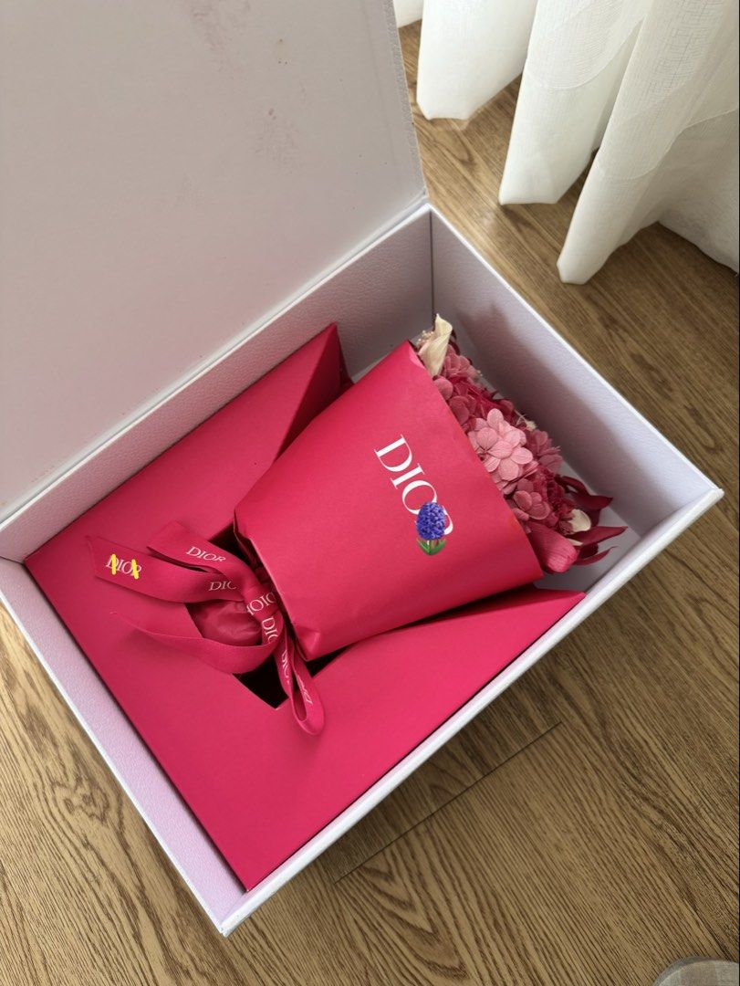 Dior Flower Bouquet in Box (Category: Flowers & Bouquets) located in Quezon City. Submitted by lc_ac (Listing ID 1436212275, Image 3). Description: - Dior flower bouquet - Presented in a signature box - Features a mix of vibrant pink flowers - Beautifully arranged and wrapped in Dior-branded paper - Includes a matching ribbon - White box with gold Dior lettering and floral accents - Perfect for Mother’s Day VVIP gift from Dior .