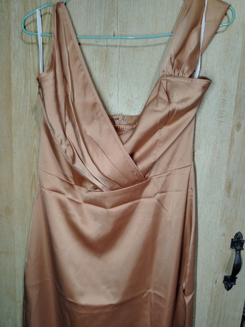 Elegant Satin Dress (Category: Dresses) located in Binangonan. Submitted by happymoon_ef9b52 (Listing ID 1436153680, Image 1). Description: - Bronze satin dress - Floor-length skirt - V-neckline - Wrap-style design - Sleeveless - Gathered shoulder detail - Perfect for formal events.