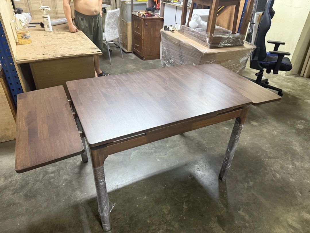 Extendable Solid wood Fold Table (Category: Tables & Sets) located in Singapore. Submitted by dingbros (Listing ID 1436141521, Image 2). Description: Solid wooden Dining Table L800 x W540 x H760mm (closed) L1080 x W800 x H760mm (extended) Solid wood table Surface Turn and flip open extension Color: American Walnut.