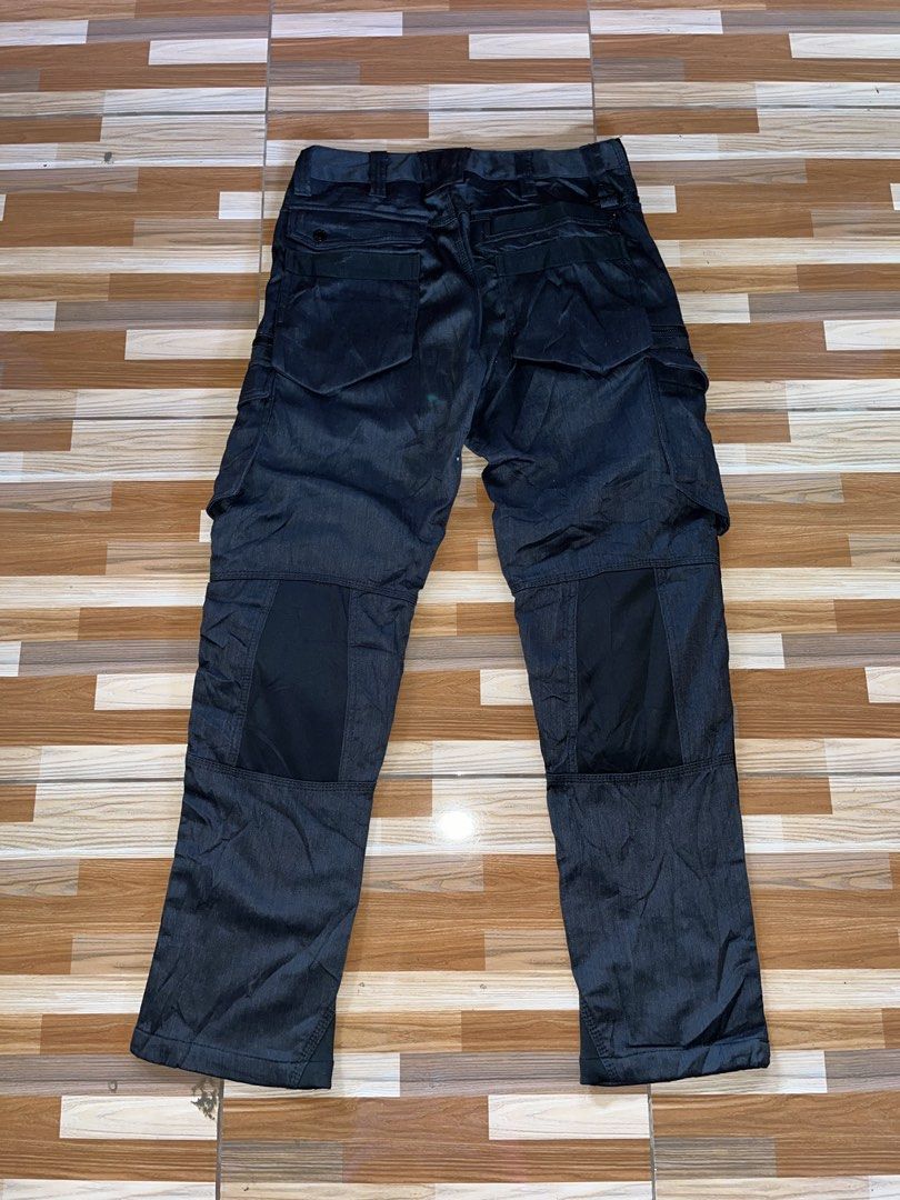 Fieldcore x Cordura Tactical Pants (Category: Jeans) located in Nabua. Submitted by lastthrift2.0 (Listing ID 1436278375, Image 3). Description: Dimes•32x39 Excellent condition - Black Cordura cargo pants - Size: L - Durable and built to last - Multiple pockets for storage - Reinforced panels for added strength - Unique design with mixed fabric panels - Button and zipper closure.