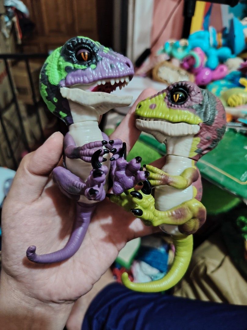 Fingerling Untamed Raptors (Category: Figurines & Statues) located in Iligan City. Submitted by shehabdor98515 (Listing ID 1436281475, Image 2). Description: - Fingerling Untamed Raptors available! - Vibrant colors and detailed designs. - Interactive and poseable toys. - Perfect for dinosaur lovers and collectors. - Bring these raptors to life! -purple w/ issue (not working on and off) - green no issue.