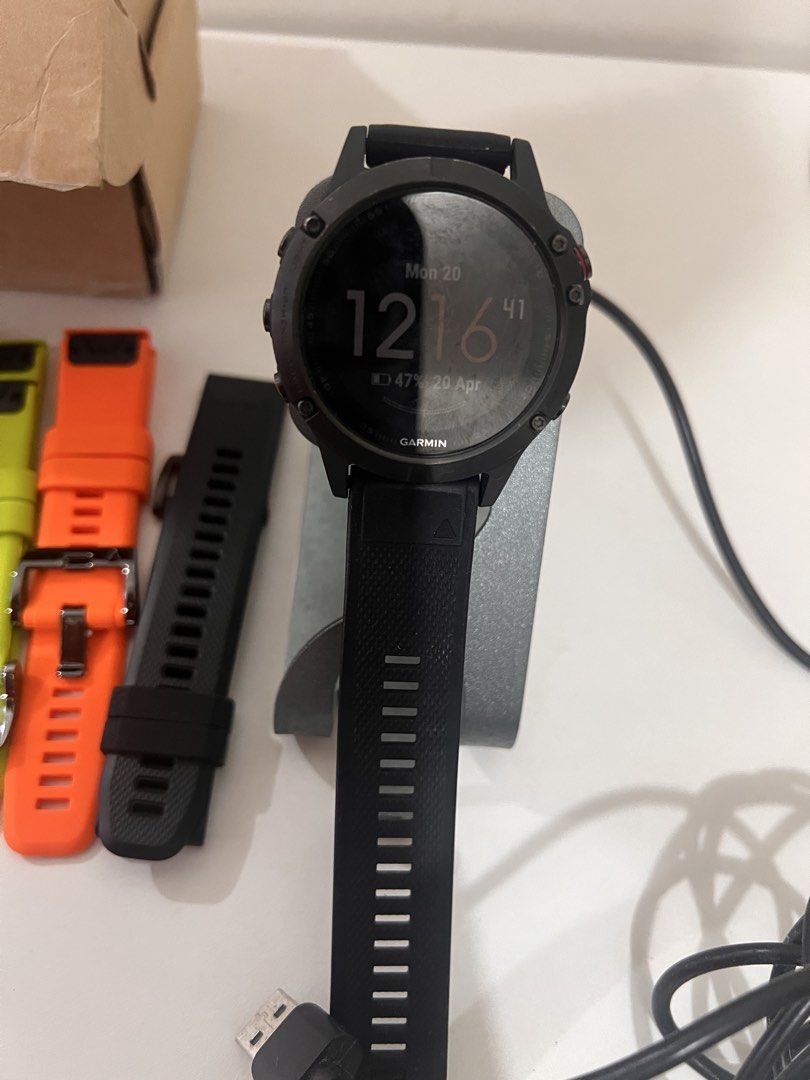 Garmin Fenix 5X Smartwatch with Extra Straps (Category: Wearables & Smart Watches) located in Quezon City. Submitted by meshtie (Listing ID 1436107490, Image 1). Description: - Garmin Fenix 5X smartwatch - Includes: - Multiple colored straps (white, blue, red, green, orange) - Charging cable - Charging dock - Displays time and date - Black watch Makunat battery! Sobra! From Us di na nagagamit Rfs. Will upgrade! Still nego for sure buyers! .