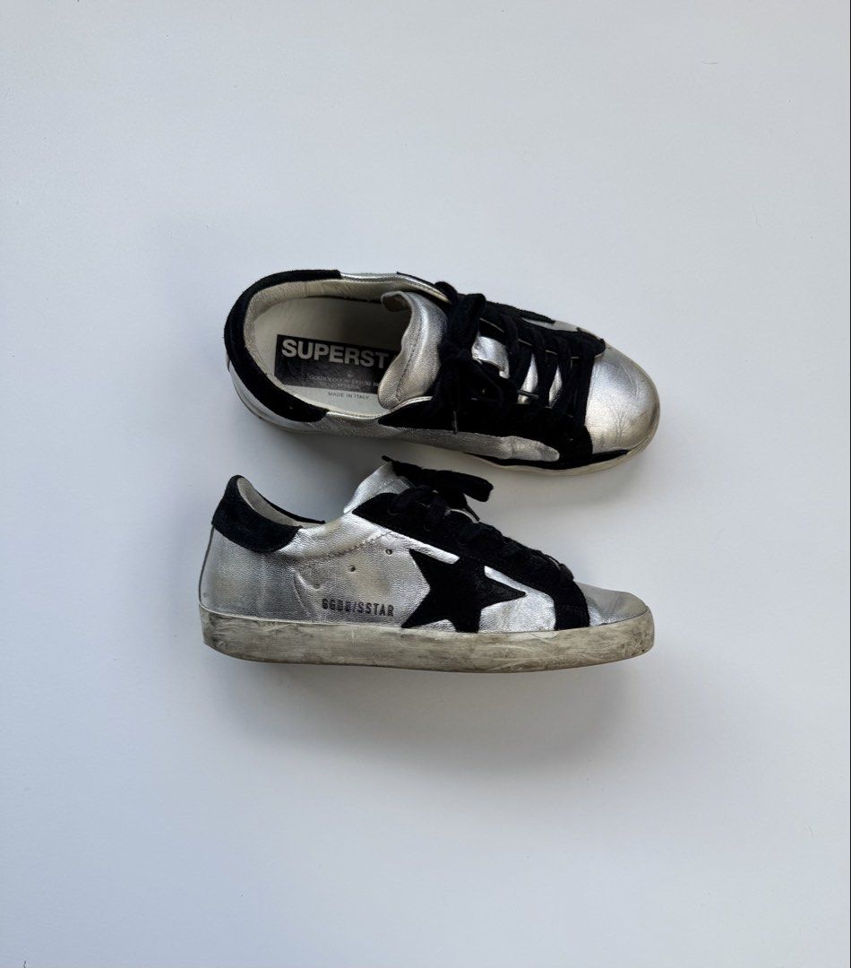 Golden Goose Deluxe Brand (Category: Sneakers) located in Davao. Submitted by LUXURY (Listing ID 1436192943, Image 1). Description: Golden Goose Deluxe Brand sneakers. Size EU 35. Silver and black design. Classic star detail. Sizs 35 Pair only Visit my profile for more luxury items.