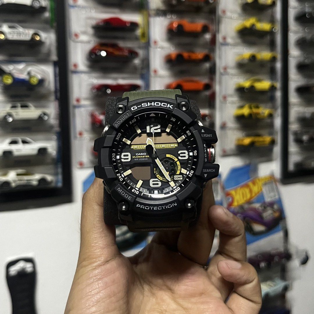 G-Shock Mudmaster Watch (Category: Men's Watches) located in Manila. Submitted by sheilasaurus (Listing ID 1436265411, Image 2). Description: Super kinis pa and once lang nagamit sa kasal. Original price was 26k and that was 3 years ago. Nego just hit me up. RFS: Decluttering (hindi bagay sa display ng mga kotse hahahahhaa) Description below: G-Shock Mudmaster watch features a black and olive green design. It has a digital display with multiple f