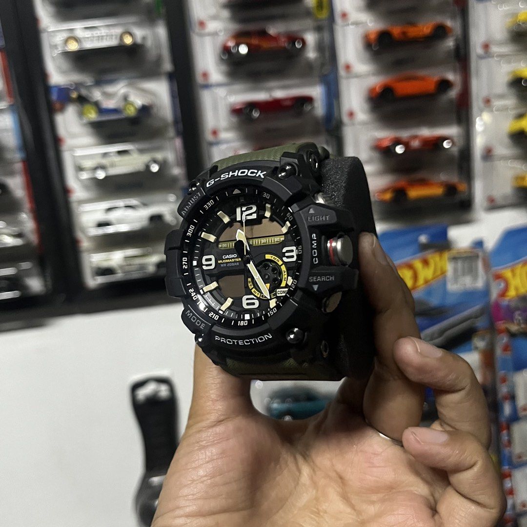 G-Shock Mudmaster Watch (Category: Men's Watches) located in Manila. Submitted by sheilasaurus (Listing ID 1436265411, Image 3). Description: Super kinis pa and once lang nagamit sa kasal. Original price was 26k and that was 3 years ago. Nego just hit me up. RFS: Decluttering (hindi bagay sa display ng mga kotse hahahahhaa) Description below: G-Shock Mudmaster watch features a black and olive green design. It has a digital display with multiple f