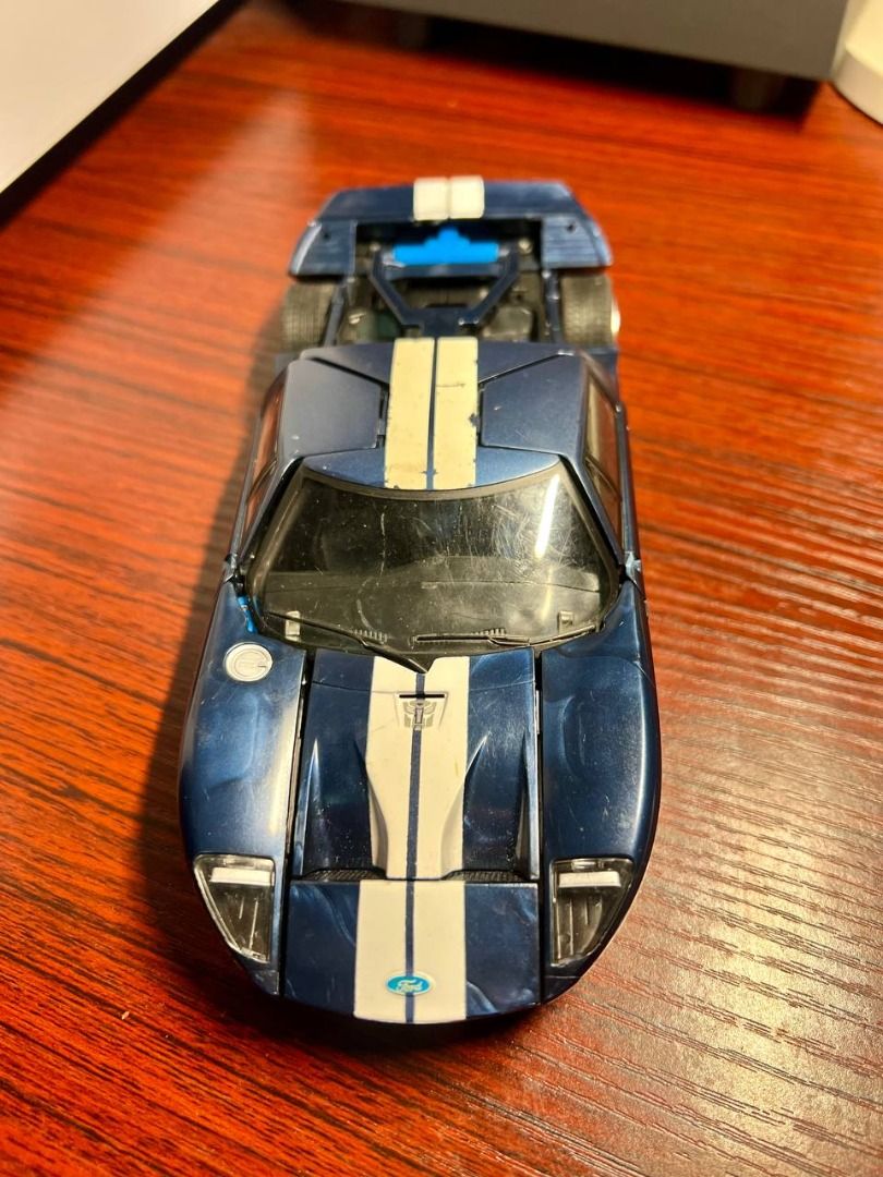 Hasbro Transformers Alternators: Ford Gt Mirage Action Figure (Category: Vehicle & Diecast Models) located in Baguio. Submitted by ditoyzb08176 (Listing ID 1436214732, Image 2). Description: - Transformers Movie 2007 Ford GT toy car - Features a blue car with white stripes - Underside reveals Transformers details - Includes 2006 Hasbro and Takara Tomy copyright markings -AS IS INCOMPLETE WYSIWYG Location: Baguio City Shipping: J&T/FLASH/LBC .