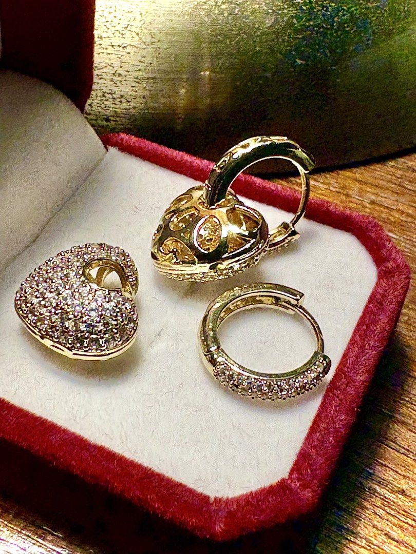 Heart-Shaped Earrings wearTwo ways (Category: Earrings) located in San Juan City. Submitted by allisgrace3 (Listing ID 1436115249, Image 2). Description: - Heart-shaped earrings wear two ways - Gold-tone finish - Unique design with detailed back - Stylish accessory for any occasion.