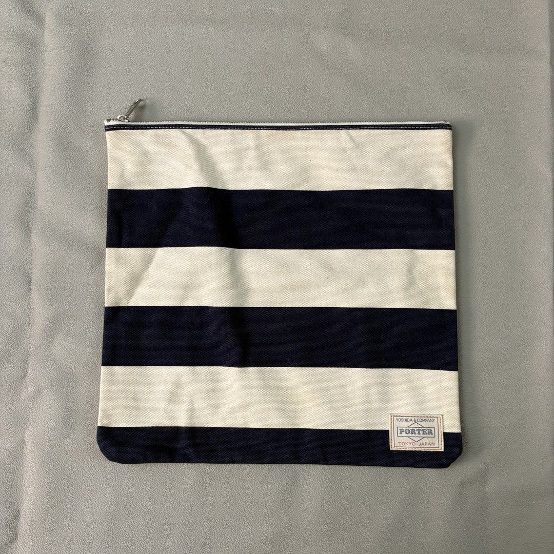 Japan porter stripped clutch bag (Category: Belt bags, Clutches and Pouches) located in Quezon City. Submitted by dufflebag_boy (Listing ID 1436117646, Image 1). Description: Japan porter stripped clutch bag -Price: 1,000 -Excellent condition HMU 📩.