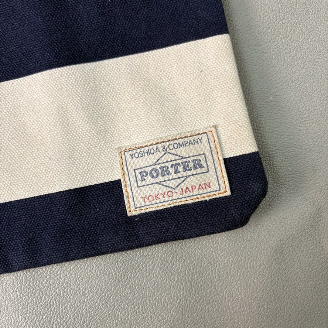 Japan porter stripped clutch bag (Category: Belt bags, Clutches and Pouches) located in Quezon City. Submitted by dufflebag_boy (Listing ID 1436117646, Image 3). Description: Japan porter stripped clutch bag -Price: 1,000 -Excellent condition HMU 📩.