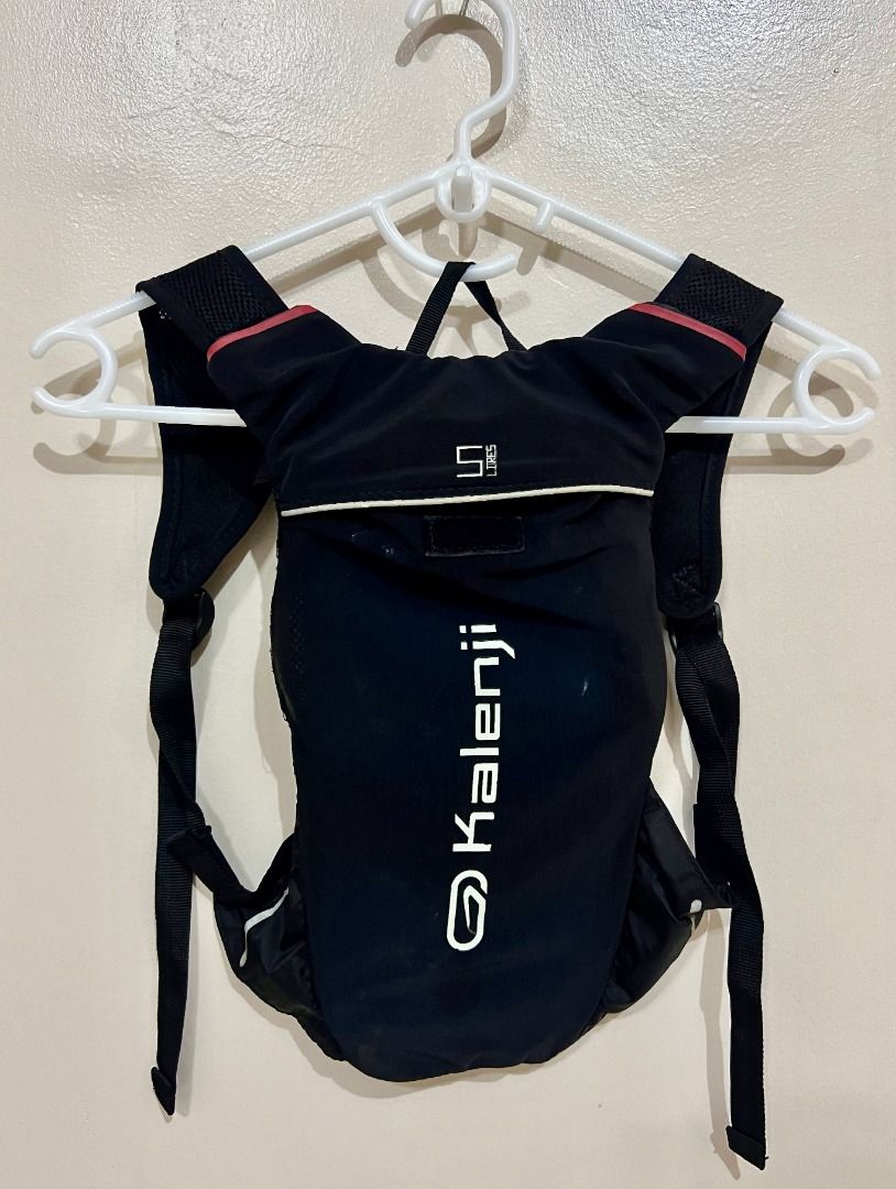 DECATHLON KALENJI Hydration Backpack with Bladder (Category: Backpacks) located in Taguig. Submitted by LessThan (Listing ID 1436225898, Image 1). Description: Kalenji hydration backpack for running and outdoor activities. Capacity: 5-liter capacity Dimension: 7" x 14" inches - Stylish black design. - Adjustable straps for a comfortable fit. - Includes a hydration bladder and drinking tube. - Ideal for staying hydrated while you're active. .